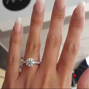 Classic round solitaire engagement ring.